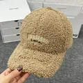 Detail of embroidered letters on thick khaki sherpa baseball cap for winter warmth - Adult Size (Adjustable) / Khaki
