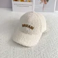 Detailed view of Dream embroidery on soft off-white teddy fabric baseball cap - Adult Size (Adjustable) / Off White