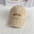 Close-up of DREAM come true 3D embroidery on beige faux lambswool baseball cap - Adult Size (Adjustable) / Beige