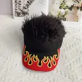 Detailed view of black wig baseball cap featuring red brim with embroidered flame pattern - Adjustable / Black Cap Black Hair