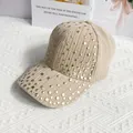 Close-up of beige corduroy baseball cap with golden rivets and striped texture detail - L / Khaki