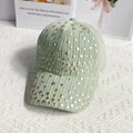 Detail of mint green corduroy baseball cap with decorative gold studs on white fabric - L / Turquoise Green
