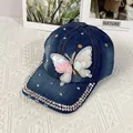 Detailed view of denim baseball cap featuring sequin butterfly and silver rhinestone studs - Adult Adjustable / Blue Butterfly Style 2