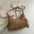 Bohemian brown faux suede crossbody bag with long fringes and adjustable strap - Khaki