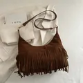 Bohemian brown suede tassel crossbody bag with adjustable strap and long fringe detail - Brown