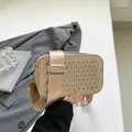 Champagne woven camera bag with silver studs and adjustable wide nylon shoulder strap - Gold