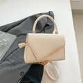 Chic beige crossbody square bag with woven texture triangle flap and gold trim - Off White