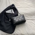 Classic black quilted tote bag with metal chain strap and turn-lock closure - Black