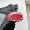 Stylish hot pink mini evening bag featuring a gold metal handle and chain strap - Pink