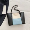Minimalist tri-color block tote bag in black, off-white, and light blue faux leather - Blue