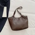 Large dark brown soft faux leather tote bag with elegant wrinkled texture for daily commute - Brown