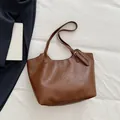 Brown soft faux leather tote bag with lychee texture and adjustable shoulder strap - Brown