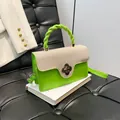 Green leather and white canvas crossbody bag with clover buckle and braided handle - Green
