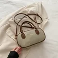Vintage khaki canvas bowling bag with brown leather handles and golden lettering detail - Khaki