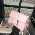 Pale pink leather square crossbody bag with large tonal buckle and long strap - Pink