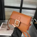 Chic brown leather crossbody bag with silver square buckle and slim shoulder strap - Brown