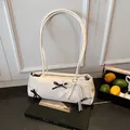 White PU leather shoulder bag with chic black bows and pearl lace ribbon charm - With Pendant / White