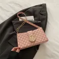 Pink small square shoulder bag with letter M print and golden circular metal buckle - Pink