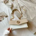 Chic two-tone crossbody box bag with beige straw texture and golden M hardware - White