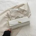 Elegant white crocodile pattern baguette bag with stylish gold twist lock and hardware - White