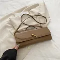 Brown crocodile embossed baguette shoulder bag with gold metal knot clasp detail - Khaki