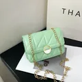 Quilted mint green crossbody bag with gold chain strap and elegant circular lock - Green