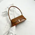 Brown patent leather baguette underarm bag with gold buckle for stylish women - Brown