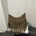 Brown suede half-moon saddle bag with golden studs and bohemian fringe tassels - Green