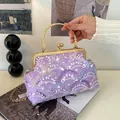 Elegant purple sequin handbag with gold handle and chain strap in a vintage design - Purple