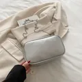 Silver metallic rectangular chain bag on a beige blazer for stylish daily wear - Silver