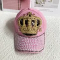 Close-up of pink baseball cap featuring golden crown embroidery and pearl beaded brim - Adult Size (Adjustable) / Pink