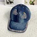 Detailed view of denim baseball cap featuring rhinestone hearts and studded brim - Adult Adjustable / Heart Style / Dark Blue