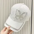 Close-up of white lace baseball cap featuring rhinestones butterfly and floral patterns - Adult Size (Adjustable) / Off White