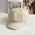 Macro detail of breathable beige linen fabric texture on a vintage newsboy cap - L / Beige