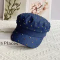 Macro detail of navy denim cadet cap with gold metal studs on a textured background - M (56-58cm) / Blue With Gold Rhinestone