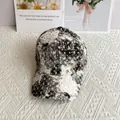 Detailed view of tweed baseball cap with sequins and golden bow accessory on side - Adult Size (Adjustable) / Black