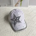 Detail of white denim baseball cap with rhinestone star and pearl bow embellishments - Pearl Star / White