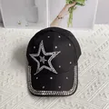 Detail of a black denim baseball cap featuring a pearl and rhinestone star decoration - Pearl Star / Black