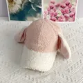 Close-up of pink lamb wool baseball cap with long rabbit ears and soft embroidery texture - Adult / White + Pink