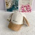 Detail of soft lamb wool fabric on a rabbit ear baseball cap with Sparkle embroidery - Adult / White + Khaki