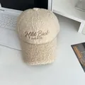 Detailed view of beige lamb wool baseball cap with embroidered Mild Back WINTER text - Adjustable / Beige