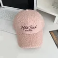 Close-up of pink sherpa baseball cap with Mild Back WINTER embroidery on white desk - Adjustable / Pink