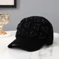 Detail of black knitted baseball cap featuring sparkling rhinestone triangle patterns - Adult / Black