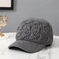 Detail of dark grey knitted baseball cap with sparkling rhinestone triangle patterns - Adult / Gray
