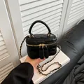 Mini black quilted crossbody bag with golden chain strap and double zipper closure - Black