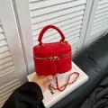 Quilted red vanity case bag with gold chain strap and top handle for women - Red