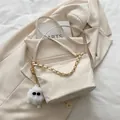 Chic cream white crossbody tote bag with gold chain strap and plush ball pendant - With Pendant / White
