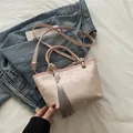 Pink jacquard bucket bag with floral landscape patterns and tassel decoration - Pink