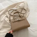 Elegant khaki lychee texture leather handbag with silver turn-lock and adjustable shoulder strap - Khaki