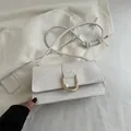 Retro white woven shoulder bag featuring a premium gold U-shaped metal buckle design - White